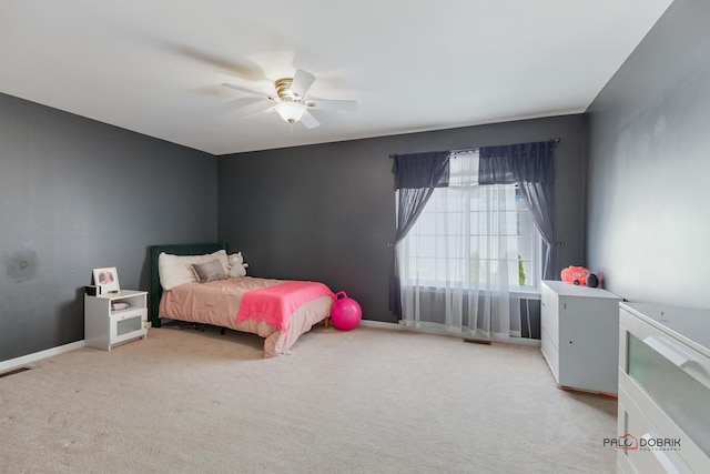 bedroom with visible vents, baseboards, ceiling fan, and carpet flooring