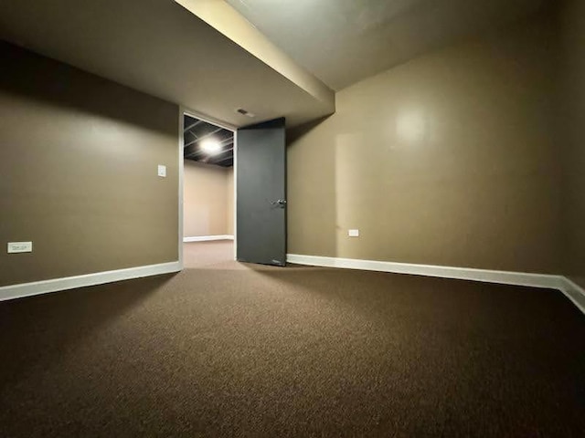 below grade area with carpet and baseboards