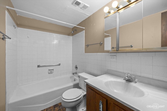 full bath with vanity, visible vents,  shower combination, tile walls, and toilet