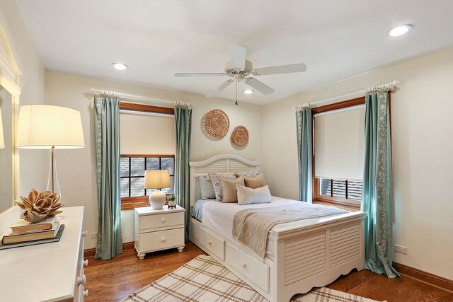 bedroom featuring recessed lighting, wood finished floors, baseboards, and ceiling fan