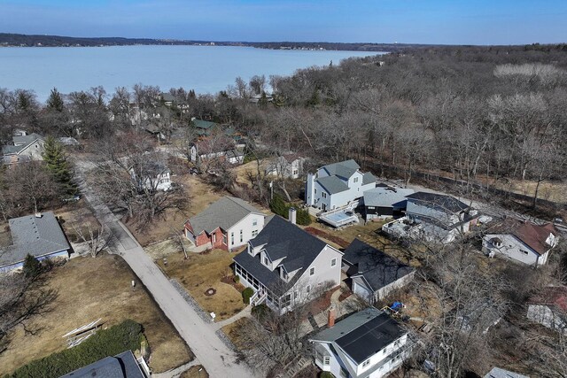 aerial view with a residential view and a water view