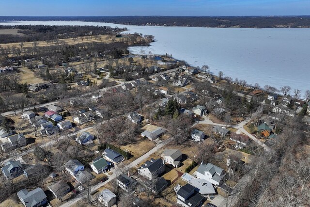 bird's eye view featuring a residential view and a water view