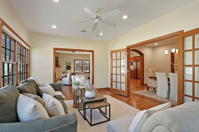 living area with recessed lighting, french doors, a ceiling fan, and wood finished floors