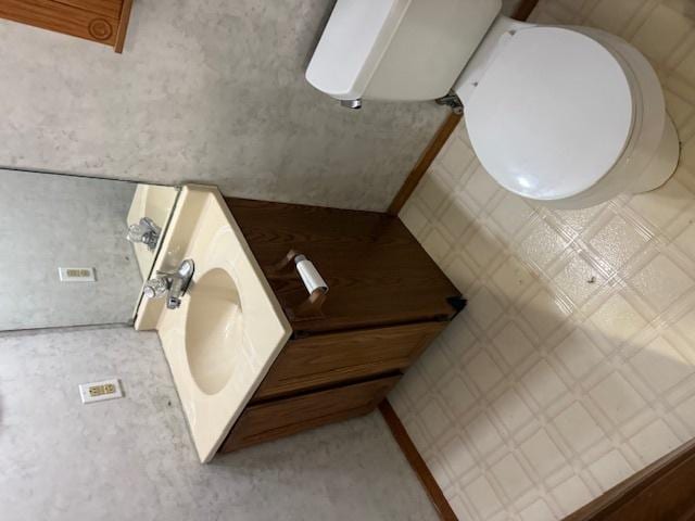 bathroom featuring toilet