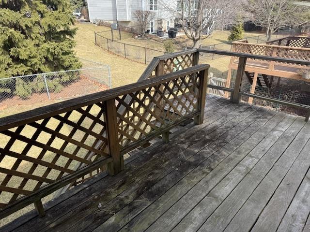 wooden deck featuring a fenced backyard