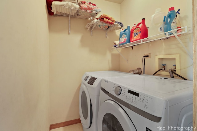 clothes washing area with washer and dryer and laundry area