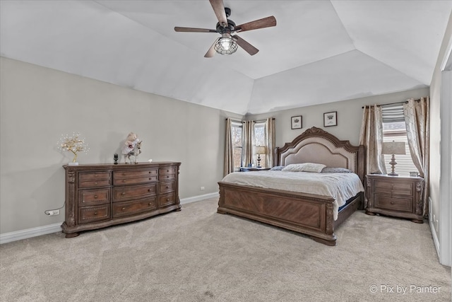 carpeted bedroom with baseboards, lofted ceiling, and a ceiling fan