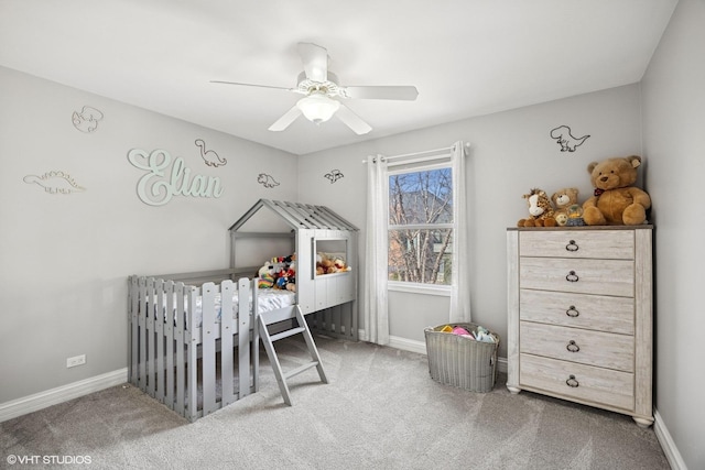 carpeted bedroom featuring baseboards and ceiling fan