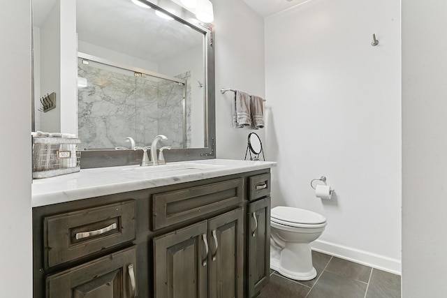 full bathroom with tile patterned floors, toilet, a stall shower, baseboards, and vanity