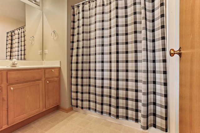 full bath with a shower with curtain and vanity