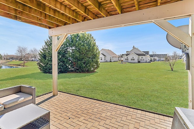 view of patio with a water view