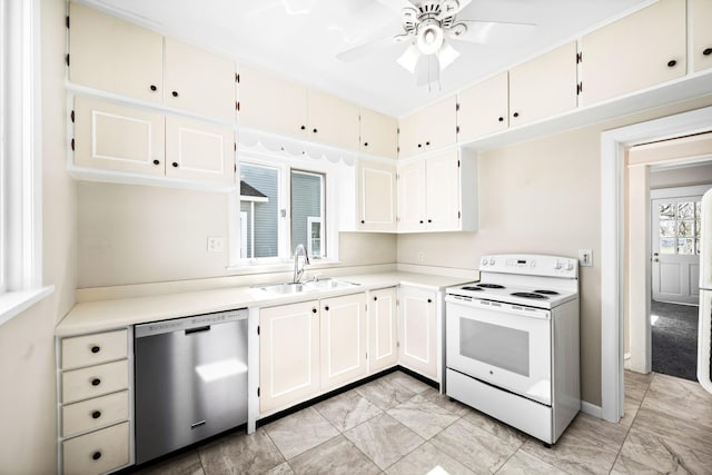 kitchen featuring white range with electric cooktop, dishwasher, light countertops, white cabinets, and a sink