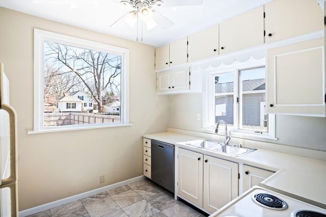 kitchen with dishwasher, light countertops, ceiling fan, and a sink