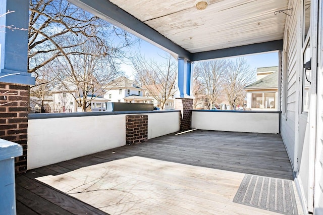 wooden terrace with a residential view