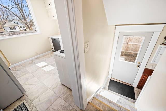 doorway to outside with visible vents, baseboards, and marble finish floor