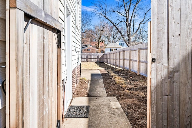 view of property exterior with a fenced backyard and a residential view