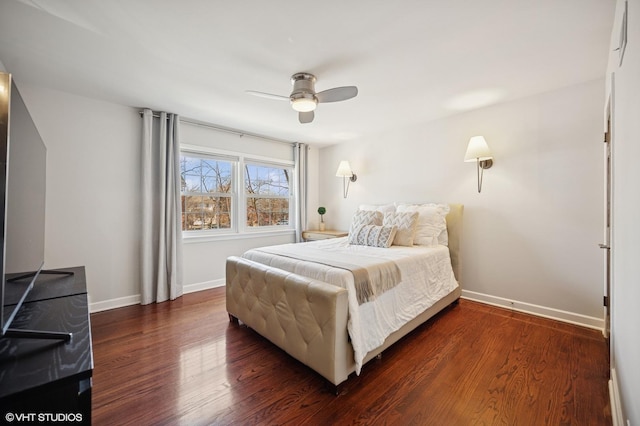 bedroom with ceiling fan, baseboards, and wood finished floors