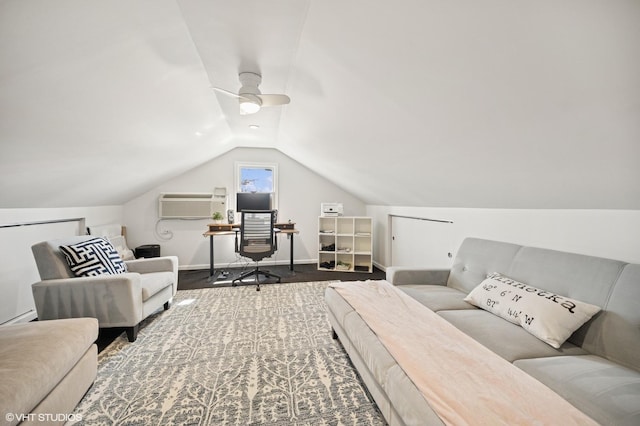 interior space featuring ceiling fan, an AC wall unit, baseboards, and vaulted ceiling