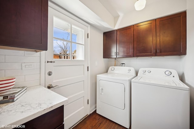 clothes washing area featuring dark wood finished floors, cabinet space, and separate washer and dryer