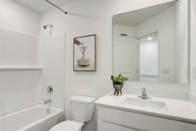 bathroom with vanity, toilet, and bathing tub / shower combination