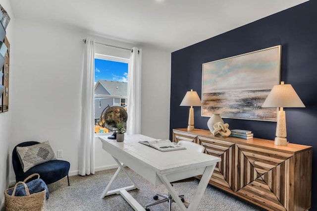 home office with light colored carpet and baseboards