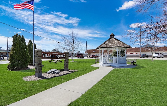 view of property's community with a gazebo and a lawn