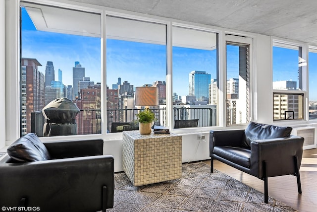 interior space featuring a city view and wood finished floors