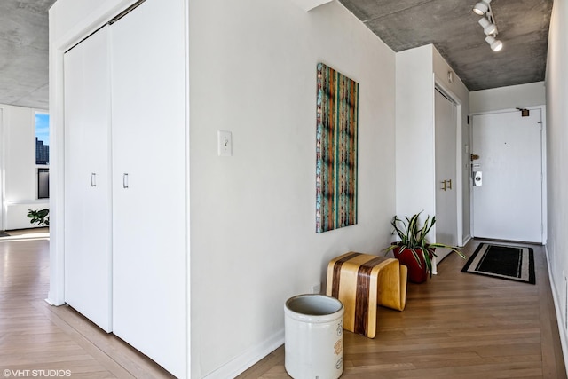 hall featuring wood finished floors