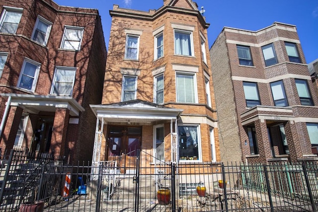 2652 W 22nd Pl, Chicago, IL 60608 - multi unit property with a fenced front yard and brick siding