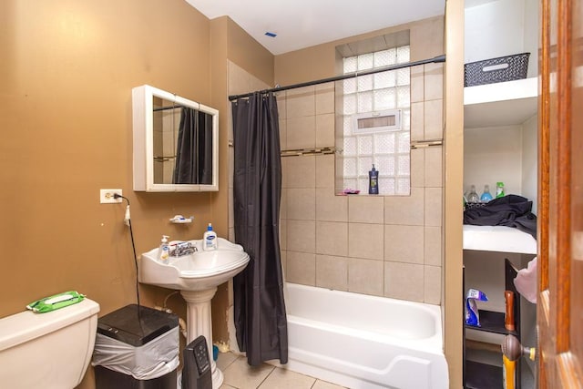 2652 W 22nd Pl, Chicago, IL 60608 - bathroom with a sink, shower / bathtub combination with curtain, toilet, and tile patterned flooring