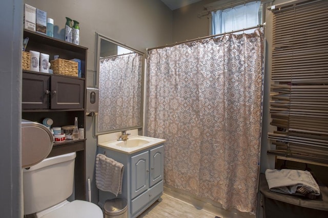 2652 W 22nd Pl, Chicago, IL 60608 - full bath with a shower with curtain, toilet, wood finished floors, and vanity