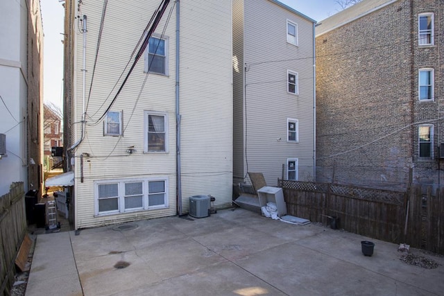 2652 W 22nd Pl, Chicago, IL 60608 - rear view of house with a patio area, fence, and central AC