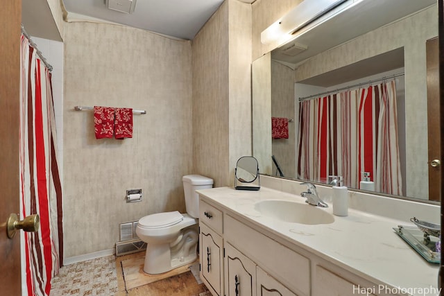 full bath featuring toilet and vanity