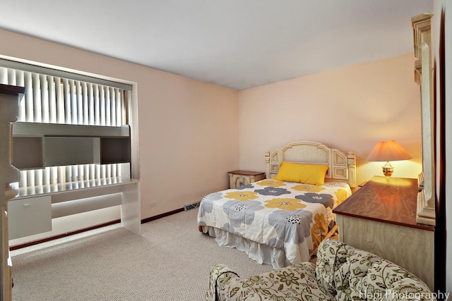 bedroom with visible vents, baseboards, and carpet floors