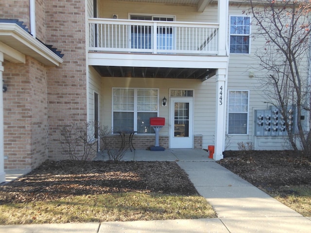 doorway to property featuring a balcony