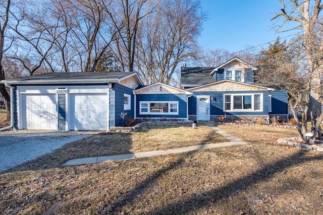 view of front facade with an attached garage, driveway, and a front yard