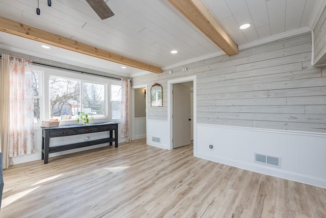 unfurnished room with recessed lighting, visible vents, beam ceiling, and light wood finished floors