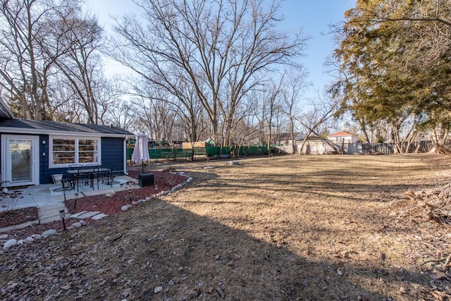 view of yard with a patio and fence