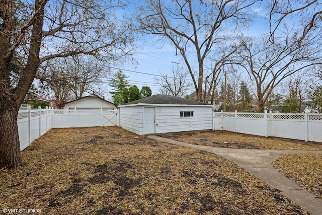 view of yard with an outbuilding and a fenced backyard