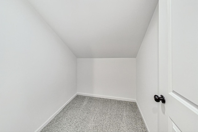 bonus room featuring lofted ceiling, baseboards, and carpet floors