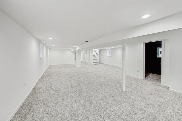 basement with stairs, recessed lighting, baseboards, and carpet floors