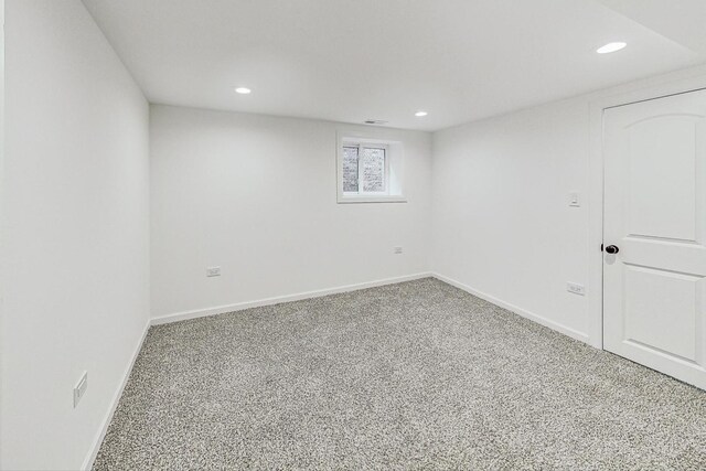 unfurnished room with carpet flooring, recessed lighting, visible vents, and baseboards