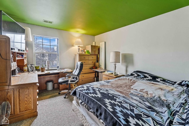 bedroom with visible vents and carpet floors