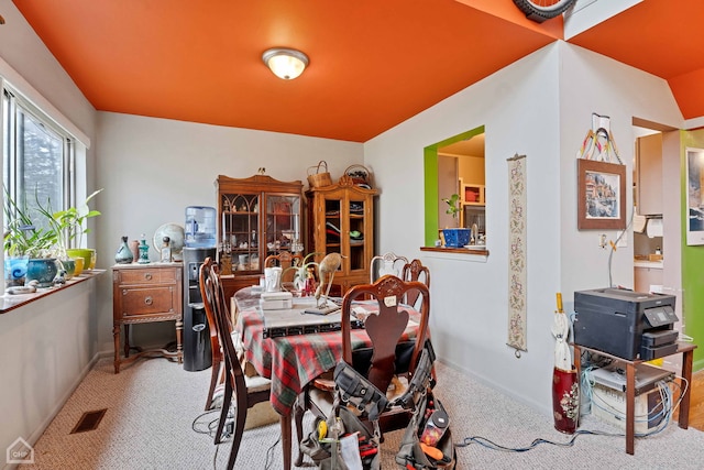 dining room featuring visible vents, baseboards, and carpet floors