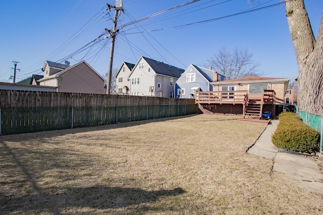 view of yard with a deck and a fenced backyard