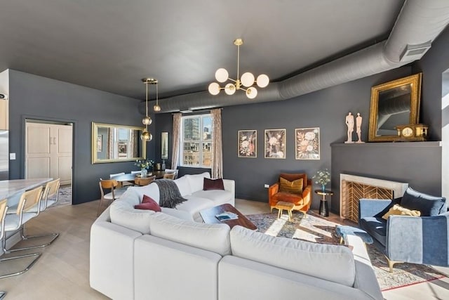 living area featuring light wood-style flooring and a notable chandelier