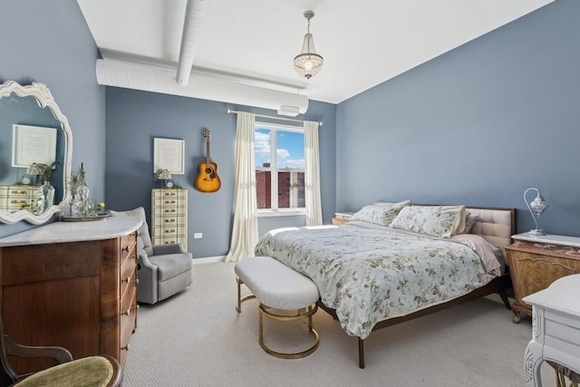 bedroom featuring light colored carpet and baseboards