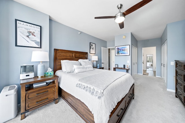 bedroom with baseboards, light carpet, and ceiling fan