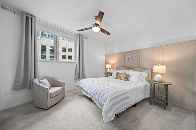 bedroom featuring baseboards, carpet floors, and ceiling fan