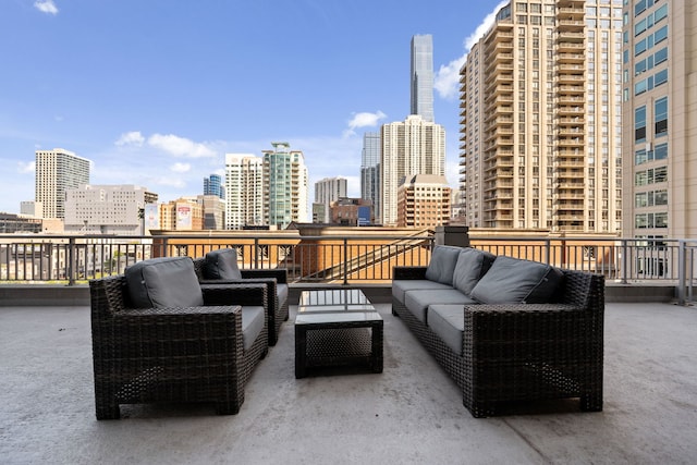 view of patio featuring an outdoor hangout area and a city view